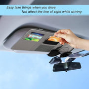 Driver using car sun visor organizer safely without blocking driving view