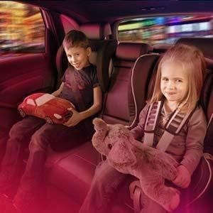Boy and girl sit on back seat of car & atmopshere light in red colour 