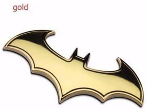 batman logo in gold colour with black shade