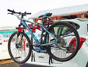 bicycle attached on stand of car