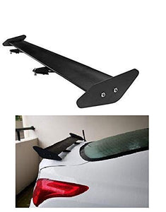 Black spoiler installed on white car dikky